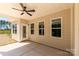 Covered patio with ceiling fan and view of backyard with mature trees and fence at 5208 Admirals Lndg, Lancaster, SC 29720