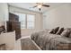 Cozy bedroom with soft bedding, neutral tones, and a large window for natural light, a serene space for relaxation at 5391 Orchid Bloom Dr, Indian Land, SC 29707