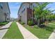 Well-maintained exterior with lush lawn and inviting walkway to the front door at 5391 Orchid Bloom Dr, Indian Land, SC 29707