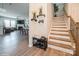 Welcoming foyer features wood floors, staircase and an open view of the living spaces at 5391 Orchid Bloom Dr, Indian Land, SC 29707