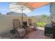 Cozy patio area with sunshade umbrella and comfortable seating at 5391 Orchid Bloom Dr, Indian Land, SC 29707