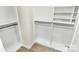 Well-organized walk-in closet with shelving and closet rods for efficient storage at 5391 Orchid Bloom Dr, Indian Land, SC 29707