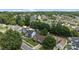 High angle view of a neighborhood displaying neatly arranged homes and tree-covered landscapes, capturing a scenic and peaceful setting at 5508 Burning Ridge Dr, Monroe, NC 28110