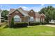 Inviting brick home with neat landscaping, arched windows, and a well-kept lawn at 5508 Burning Ridge Dr, Monroe, NC 28110