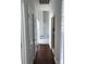 Hallway boasting dark wood floors and leading to rooms with fresh neutral paint, offering a welcoming and bright transition at 5508 Burning Ridge Dr, Monroe, NC 28110