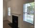 Inviting living room with a classic fireplace, large windows, and neutral walls create a serene ambiance at 5508 Burning Ridge Dr, Monroe, NC 28110