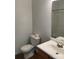 Toilet in bright bathroom with sink and doorway at 5508 Burning Ridge Dr, Monroe, NC 28110