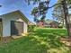 Expansive backyard with a shed, beautiful lawn, a deck with outdoor seating, and mature trees at 5921 Meadowmere Dr, Monroe, NC 28110