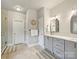 Neutral bathroom features double vanity, mosaic backsplash, and glass enclosed shower at 5921 Meadowmere Dr, Monroe, NC 28110