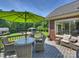 Inviting deck features outdoor seating, a dining table, and an umbrella for relaxing and entertaining at 5921 Meadowmere Dr, Monroe, NC 28110