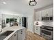Bright kitchen and dining space with stainless appliances and a view to the outdoor area at 5921 Meadowmere Dr, Monroe, NC 28110