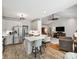 Open-concept kitchen featuring stainless steel appliances and breakfast bar seating at 5921 Meadowmere Dr, Monroe, NC 28110