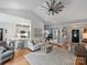 Open-concept living room connects to the kitchen, featuring modern decor and lots of natural light at 5921 Meadowmere Dr, Monroe, NC 28110