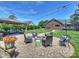 Well-designed backyard patio featuring a gazebo, fire pit, seating, and string lights for outdoor enjoyment at 5921 Meadowmere Dr, Monroe, NC 28110