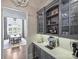 Stylish bar area featuring custom cabinetry, wine storage, and modern appliances at 6314 Saint Stephen Ln, Charlotte, NC 28210