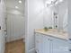 Bright bathroom featuring a granite countertop, white cabinets, neutral walls, and shower with white curtain at 6314 Saint Stephen Ln, Charlotte, NC 28210