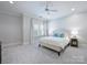 Bright bedroom with neutral walls, soft carpet, crown molding, and a plush king-sized bed at 6314 Saint Stephen Ln, Charlotte, NC 28210
