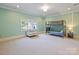 Spacious bedroom with large window, carpeted floor, and a bunk bed at 6314 Saint Stephen Ln, Charlotte, NC 28210