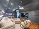 Cozy bonus room with modern lighting, sitting area, TV, and a ping pong table for recreation at 6314 Saint Stephen Ln, Charlotte, NC 28210