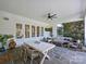 Spacious covered patio featuring a dining area, multiple seating areas, and elegant French doors at 6314 Saint Stephen Ln, Charlotte, NC 28210
