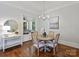 Charming dining room with hardwood floors, stylish lighting, and access to the outdoor space at 6314 Saint Stephen Ln, Charlotte, NC 28210