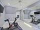 Home gym with stationary bike, large mirror, and ample room for a complete workout setup at 6314 Saint Stephen Ln, Charlotte, NC 28210