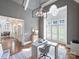 Stylish home office with gray walls, modern lighting, hardwood floors, and a window with shutters at 6314 Saint Stephen Ln, Charlotte, NC 28210