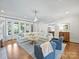 Bright living room boasts hardwood floors, stylish furnishings, and seamless flow to the kitchen at 6314 Saint Stephen Ln, Charlotte, NC 28210