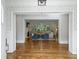 Bright living room with fireplace, hardwood floors, modern decor, and lots of windows at 6314 Saint Stephen Ln, Charlotte, NC 28210