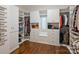 Organized walk-in closet with custom shelving, drawers, and ample storage space at 6314 Saint Stephen Ln, Charlotte, NC 28210