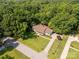 Aerial view of the home showcasing mature trees, expansive lot, and circular driveway at 637 Freemont Dr, Lancaster, SC 29720