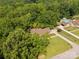Aerial view shows pool, surrounding greenery, and an expansive driveway at 637 Freemont Dr, Lancaster, SC 29720