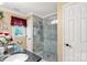 Modern bathroom featuring granite countertops, glass-enclosed shower, and elegant finishes at 637 Freemont Dr, Lancaster, SC 29720