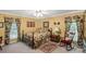 Welcoming bedroom offers a bed, a rug, a rocking chair, and floral-themed decorations at 637 Freemont Dr, Lancaster, SC 29720