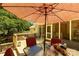 Inviting deck area with outdoor seating and shaded by a large umbrella at 637 Freemont Dr, Lancaster, SC 29720