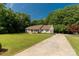 Traditional single-story home featuring a long driveway and a well-manicured lawn at 637 Freemont Dr, Lancaster, SC 29720
