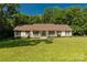 Charming ranch home with a covered porch, lush lawn, and mature trees at 637 Freemont Dr, Lancaster, SC 29720
