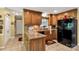 Well-appointed kitchen featuring granite countertops, wood cabinets, and modern black appliances at 637 Freemont Dr, Lancaster, SC 29720