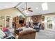 Cozy living room with vaulted ceilings, a brick fireplace, and comfortable seating at 637 Freemont Dr, Lancaster, SC 29720