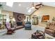 Cozy living room with brick fireplace, ceiling fan, and plenty of natural light from skylights at 637 Freemont Dr, Lancaster, SC 29720