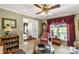 Charming living room featuring an accent chair, patterned rug, and large window at 637 Freemont Dr, Lancaster, SC 29720