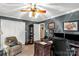 Spacious office includes a desk, storage cabinet, and recliner creating a cozy work environment at 637 Freemont Dr, Lancaster, SC 29720