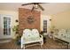 Cozy porch with brick accent wall, decorated with green plants and floral wreath at 637 Freemont Dr, Lancaster, SC 29720