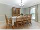 Elegant dining room featuring a large window and classic chandelier at 7118 Powder Mill Pl, Charlotte, NC 28277