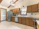 Functional kitchen with stainless steel appliances and ample cabinetry at 7118 Powder Mill Pl, Charlotte, NC 28277