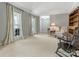 Spacious living room with large windows and neutral color palette at 7118 Powder Mill Pl, Charlotte, NC 28277