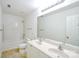 Bright bathroom features double sinks, white cabinets, and a shower-tub combo at 722 Overlook Rd, Lowell, NC 28098