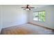 Bright bedroom featuring a ceiling fan and large window at 722 Overlook Rd, Lowell, NC 28098