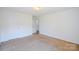 Spacious bedroom with neutral carpeting and ample closet space at 722 Overlook Rd, Lowell, NC 28098