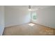 Bright bedroom with a ceiling fan and natural light from the window at 722 Overlook Rd, Lowell, NC 28098